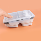 Two-compartment portable foldable silicone food storage container (fork included)